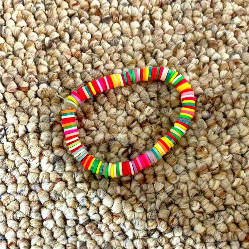 Flat beaded rainbow braclet.  Pack of 4!